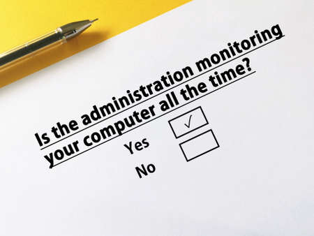 One person is answering question about cybersecurity. The person thinks the administration is monitoring his computer all the time.の写真素材