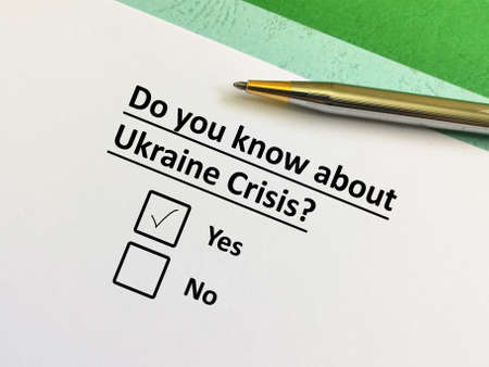 One person is answering question about conflict and war. The person thinks that he knows about Ukraine crisis.の写真素材
