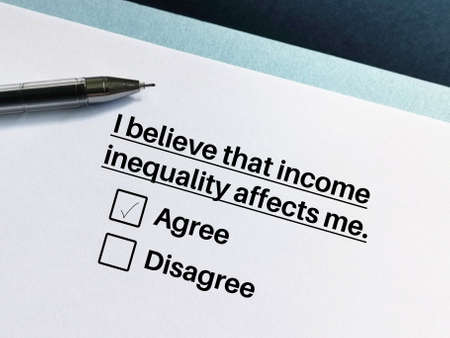 One person is answering question about social inequality. The person believes that income inequality affects him.の写真素材