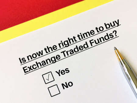One person is answering question about investment. He thinks it  is now the right time to buy exchange traded funds.の写真素材