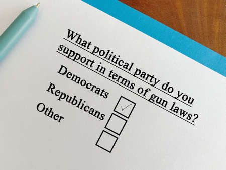 One person is answering question about firearm. The person is supporting democrats in terms of gun laws.の写真素材