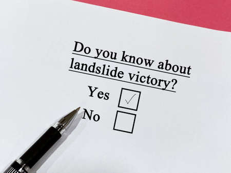 One person is answering question about politics. He knows about landslide victory.の写真素材