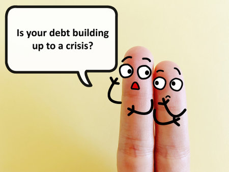 Two fingers are decorated as two person. One of them is asking another if his debt is building up to a crisis.の写真素材