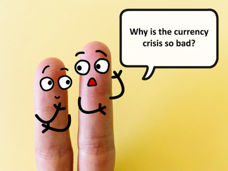 Two fingers are decorated as two person. One of them is asking why is the currency crisis so bad.の写真素材
