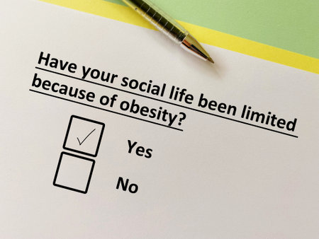 One person is answering question about diet. His social life has been limited because of obesity.の写真素材
