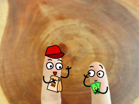 Two fingers are decorated as two person. They are talking to each other. The food was delivered on time.の写真素材