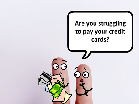Two fingers are decorated as two person. One of them is asking another if he is struggling to pay his credit card.の写真素材