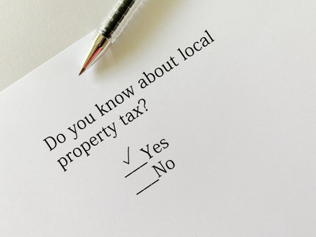 A person is answering question about taxation. He knows about local property tax.の写真素材