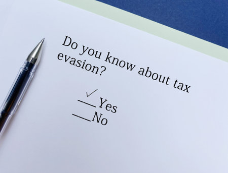 A person is answering question about taxation. He knows about tax evasion.の写真素材