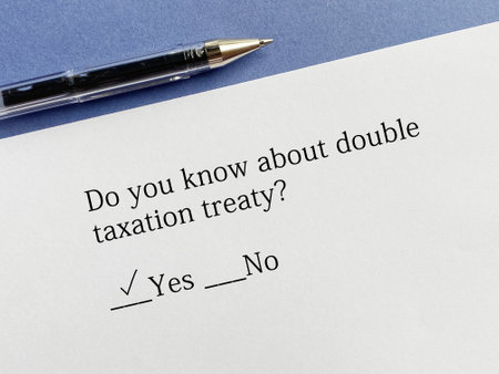 A person is answering question about taxation. He knows about double taxation treaty.の写真素材
