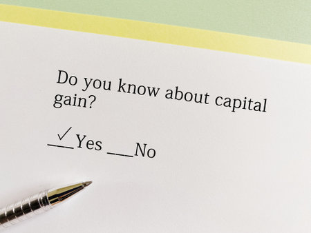 A person is answering question about taxation. He knows about capital gain.の写真素材