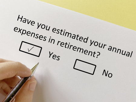 A person is answering question about finance. He has estimated his annual expenses in retirement.の写真素材