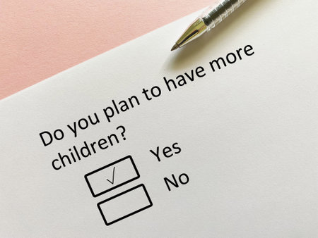 A person is answering question about finance. He plans to have more children.の写真素材