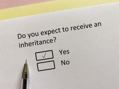 A person is answering question about finance. He expects to receive an inheritance.の写真素材