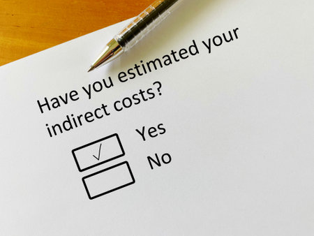 A person is answering question about finance. He has estimated his indirect costs.の写真素材