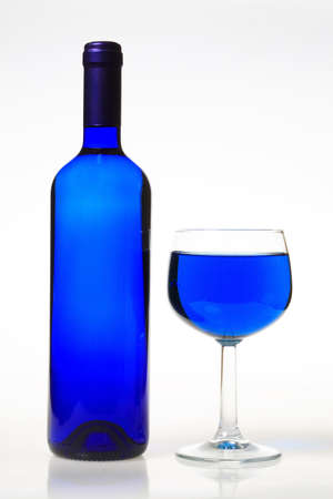 Blue wine glass and bottleの写真素材