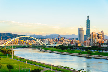 skyline of the taipei city by the riverの写真素材