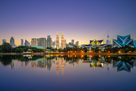 Skyline of Kuala Lumpur by the lake at duskの写真素材
