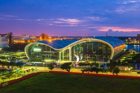 Kaohsiung, Taiwan - July 28, 2019: night view of Kaohsiung Exhibition Center, a convention center designed by Australian architect, Philip Cox, and opened on 14 April 2014.のeditorial素材