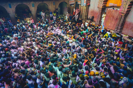 March 1, 2018: Vibrant colours whirled in air at Bankey Bihari Temple in Vrindavan, Mathura, India. Holi is an ancient Hindu festival, aka festival of spring, that celebrates the arrival of springのeditorial素材