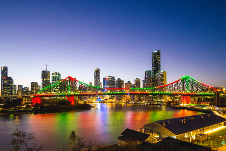 skyline of brisbane by brisbane river in queensland, australia at nightの写真素材