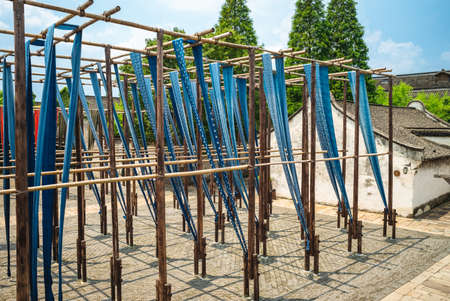 Wuzhen Indigo dyed fabric drying in historic town, wuzhen, chinaの写真素材