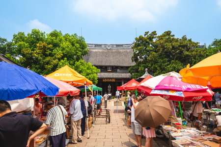 July 29, 2018: Used book market at Confucian Temple in the Huangpu District of Shanghai, China. It has been held every Sunday since 1993. Books, magazines, newspapers, comic strips can be found hereのeditorial素材