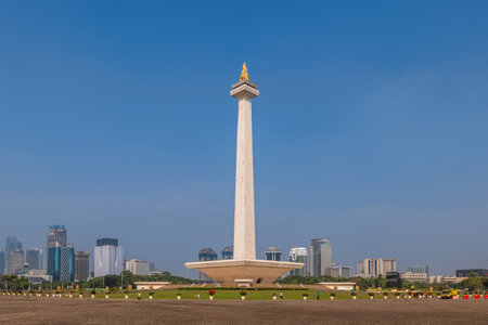 July 12, 2023: National Monument standing in the middle of the Merdeka Square, a large square located in the center of Jakarta, Indonesiaのeditorial素材