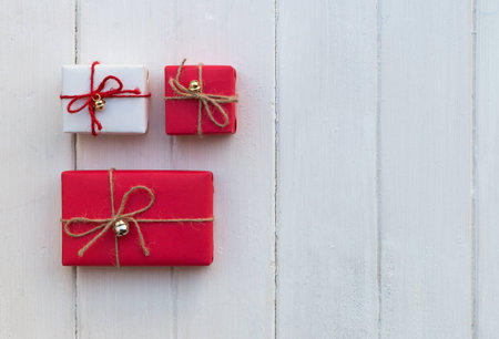 Handmade gift boxes on white wood background.  Flat laying in top viewの写真素材