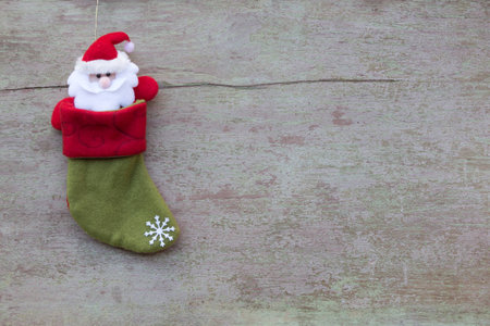 Christmas socks and Christmas decoration on white wooden background, flat laying in top viewの写真素材