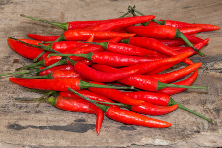 ed chili, chillies on wood background.の写真素材