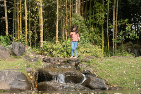 Beatiful and smily kid enjoying of the park. Outdoors actionsの写真素材