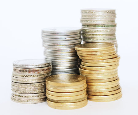 Financial or savings growth concept with stacks of golden and silver Indian currency coins stacked...