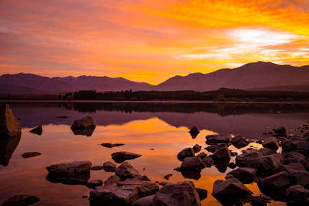 Lake Tekapo in the glow of the spring sunriseの写真素材