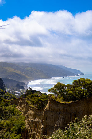 Cathedral Gully, clay cliffs in Canterbury New Zealand. View of the cliffs, with Gore Bay in the backgroundの写真素材