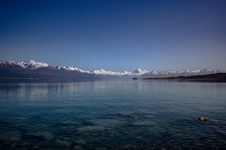 Lake Pukaki in the morning, New Zealand. With the Southern Alps in the distanceの写真素材