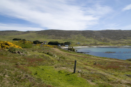 An isolated farm in a peaceful bay in the Falkland Islands.の写真素材