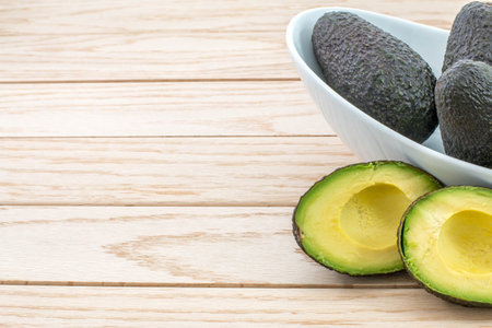 Avocados on a wood table