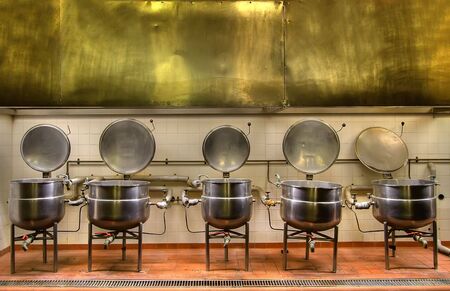View of the old cooking pots in a disused prison kitchenの写真素材