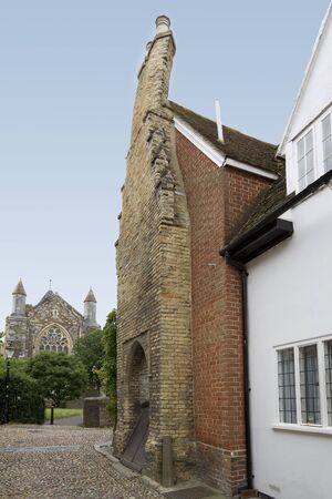 View of a very old brick house with a very bent chimneyの写真素材