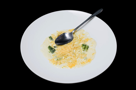 Photo vegetables in creamy sauce on a white plateの写真素材