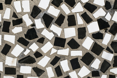 The texture of the old wall is decorated with mosaic slices of ceramic tiles in high resolution. Textures mapping for computer graphics, design and 3D visualizationの写真素材