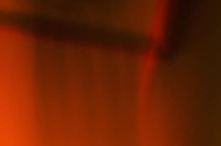 Vertical blur red background with brown shadow on the topの写真素材