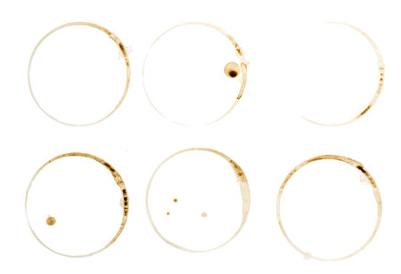 Lot of circle shape coffee stains on white background 
