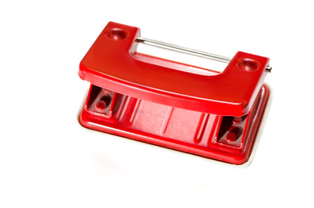 Red punching machine made of metal isolated on white background.の写真素材