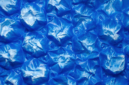 Detail of blue plastic damaged pallet, abstract background.