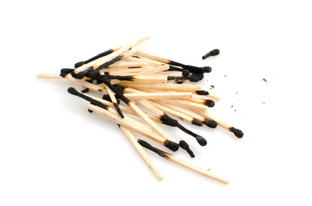 Pile of used matches isolated on white background.の写真素材