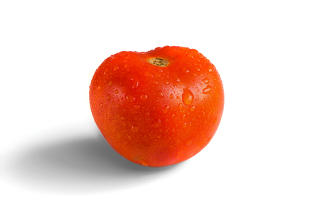 Fresh dewy tomato isolated on white backgorund.の写真素材