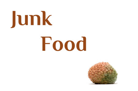 Junk food text and litchi isolated on white background.