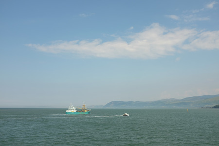 A mussel fishing boat heading to port on the Menai Straits, Wales, UK, on the 01/07/ 2014.の写真素材